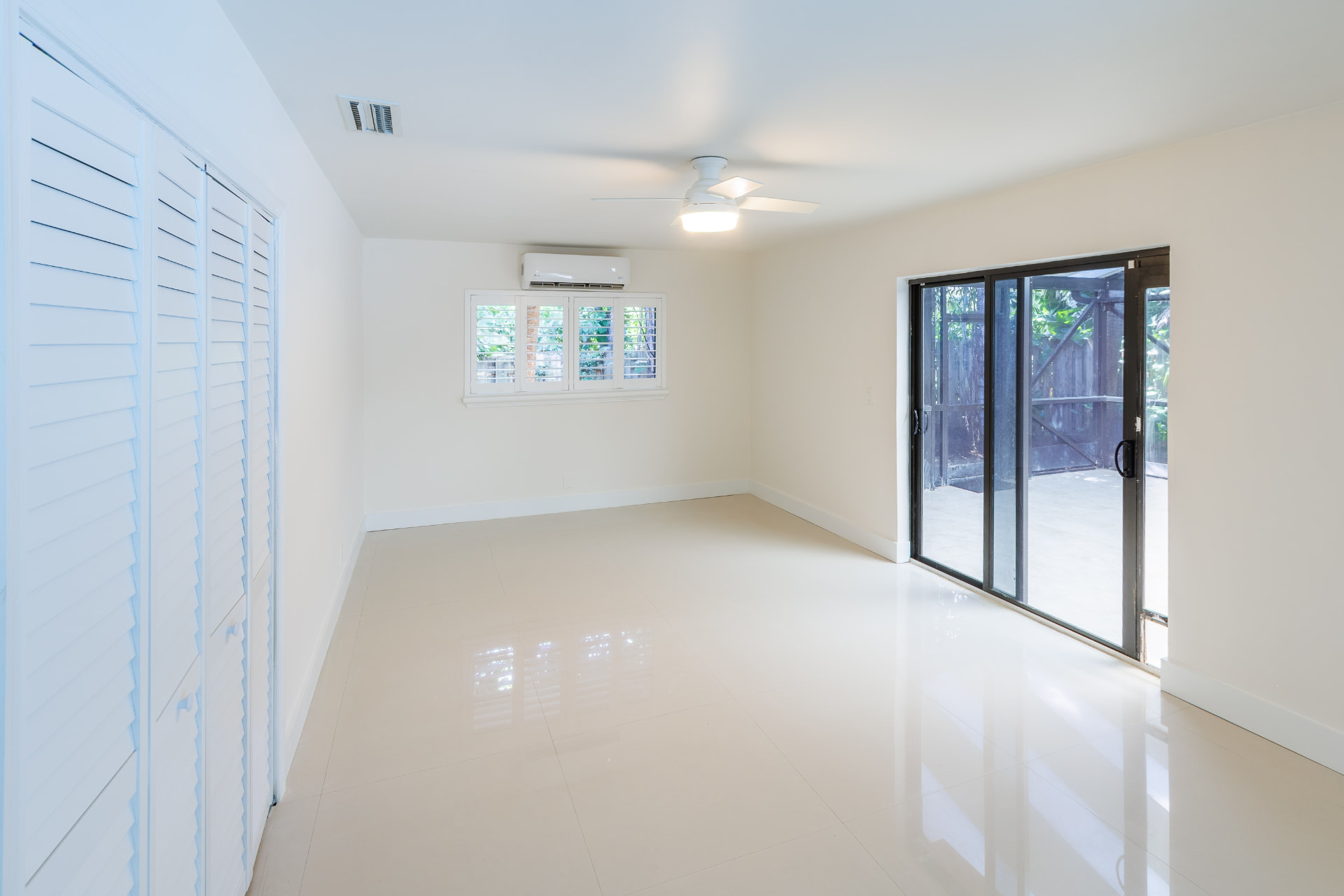Bedroom with sliding glass doors to the garden terrace