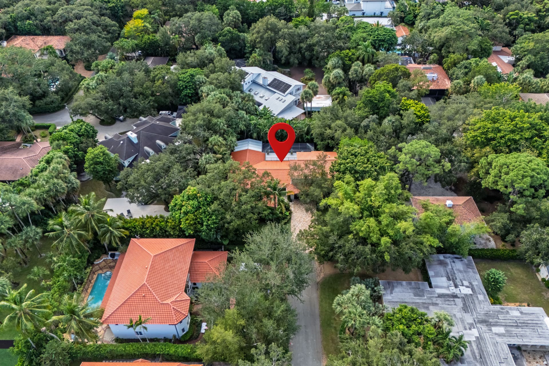 Close aerial view of the residence on its cul-de-sac