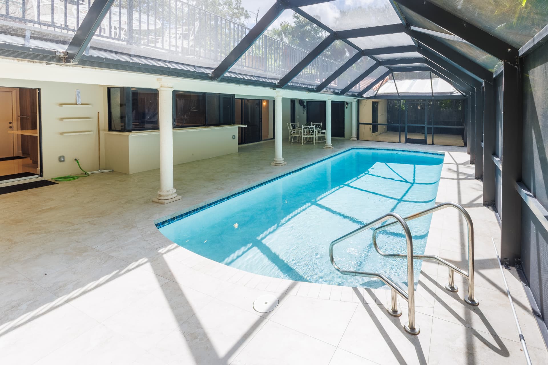 Private pool beneath the screened enclosure