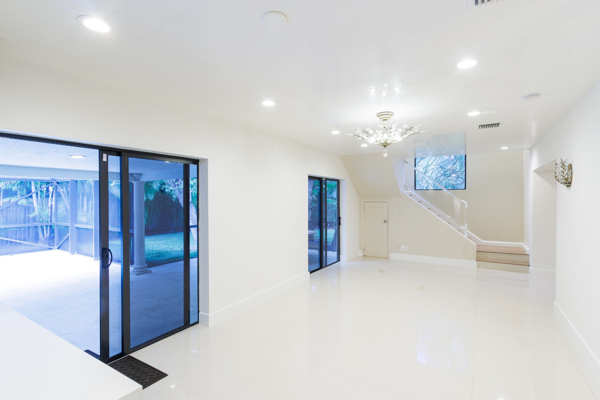 Family room with sliding glass doors opening to the screened patio