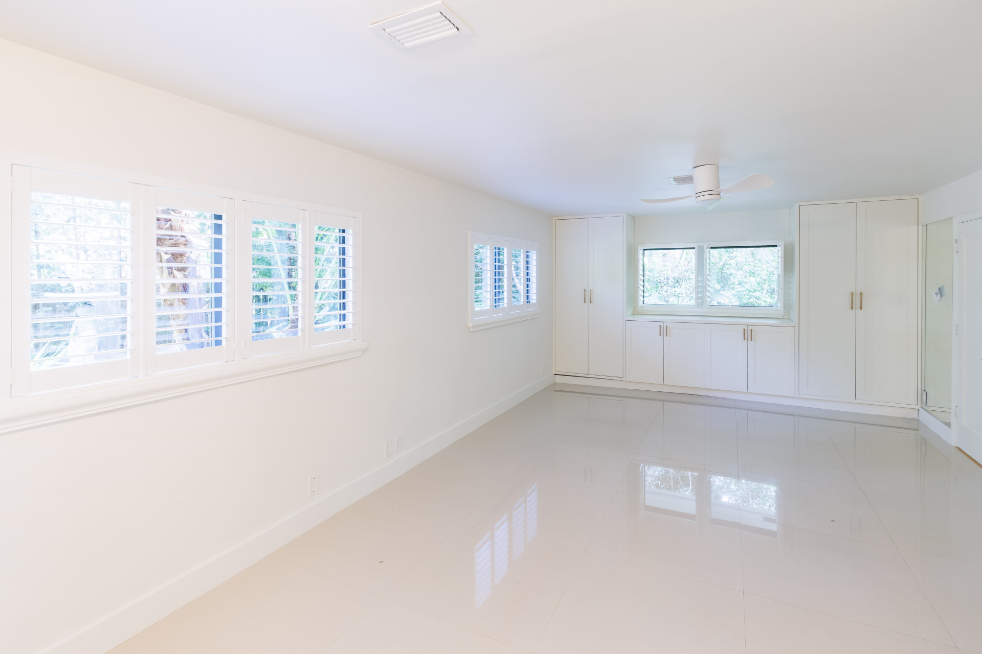 Primary suite with built-in cabinetry and plantation shutters