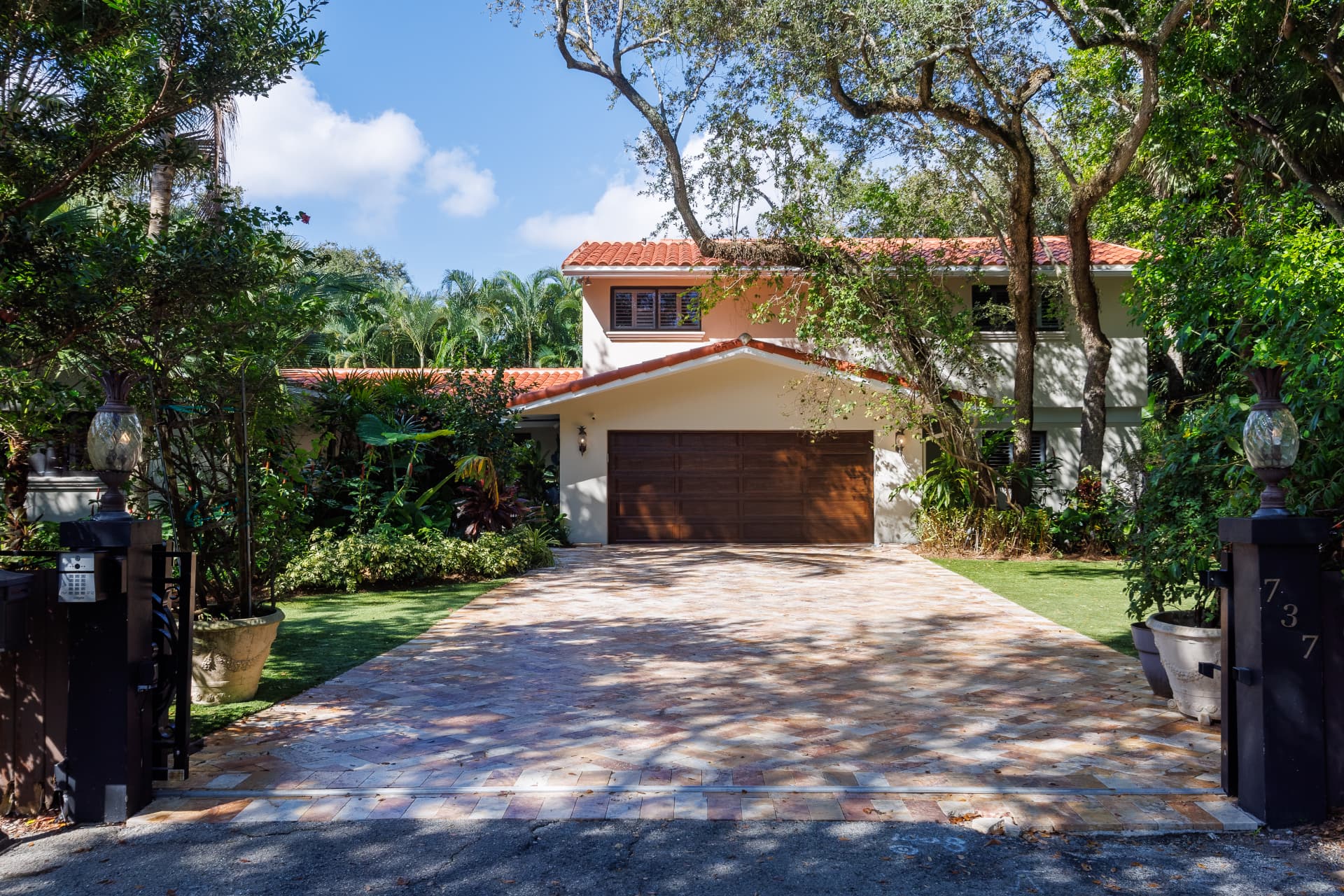 Gated entry and driveway leading to the residence